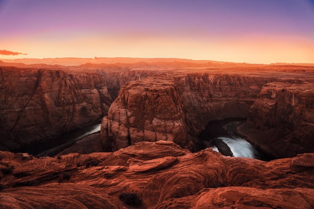 a large canyon with a river running through it