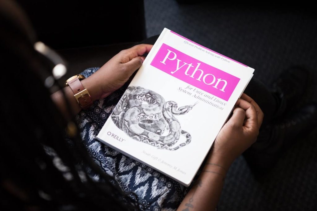 a hand holding a book