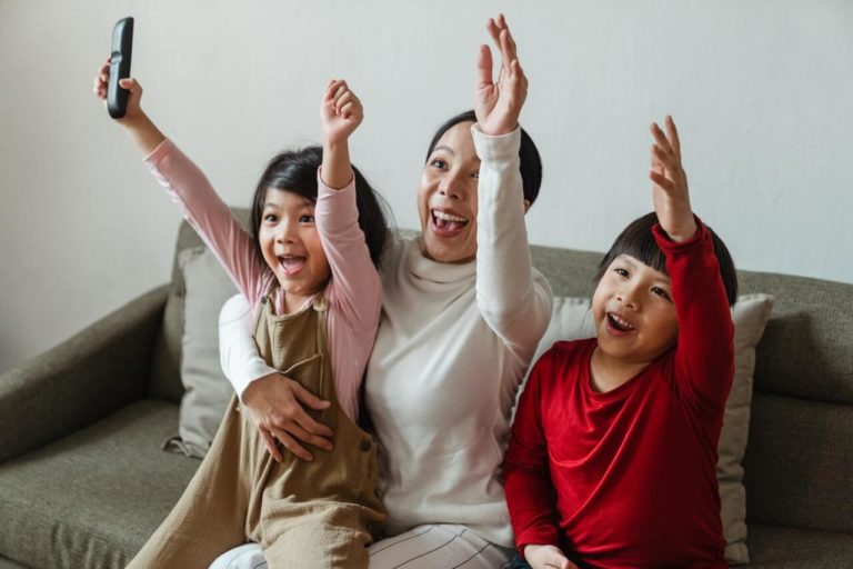a group of people raising their hands