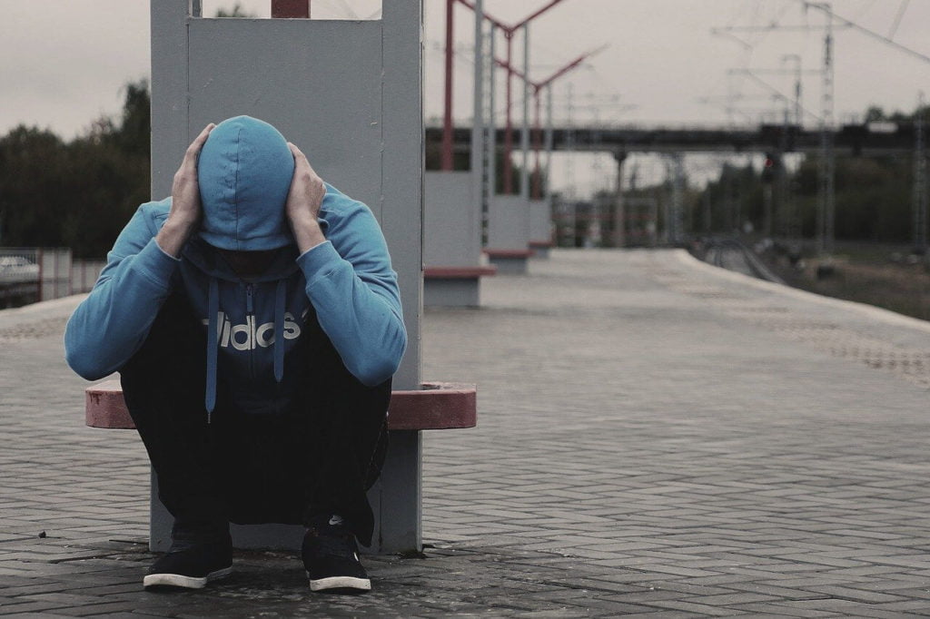 a person sitting on a bench