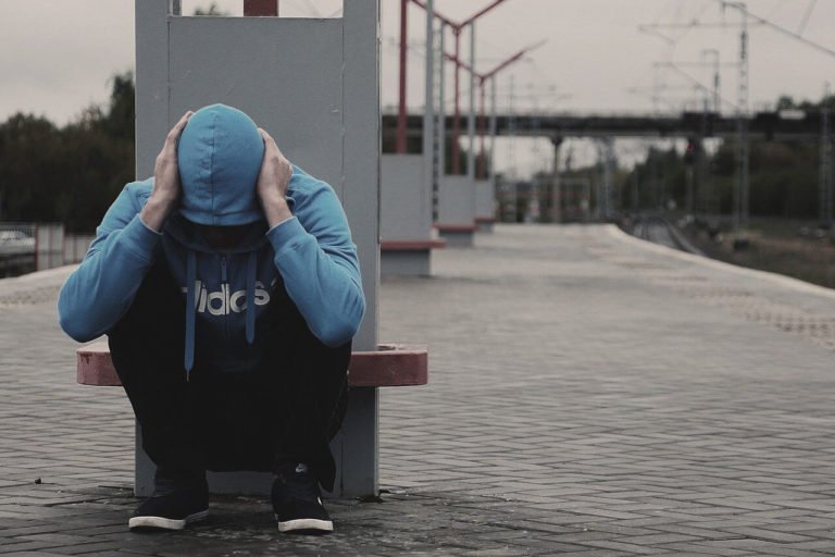 a person sitting on a bench
