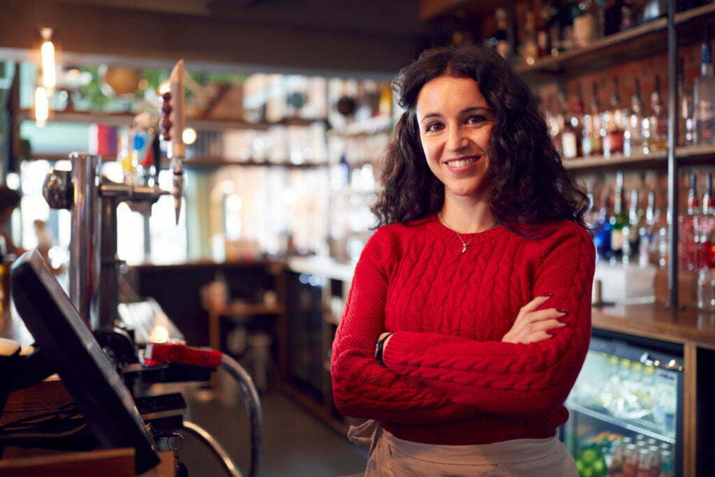 a person standing in a bar