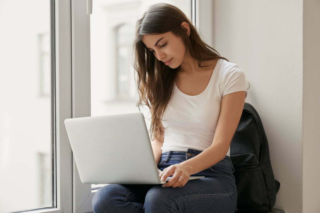 young women working on a laptop