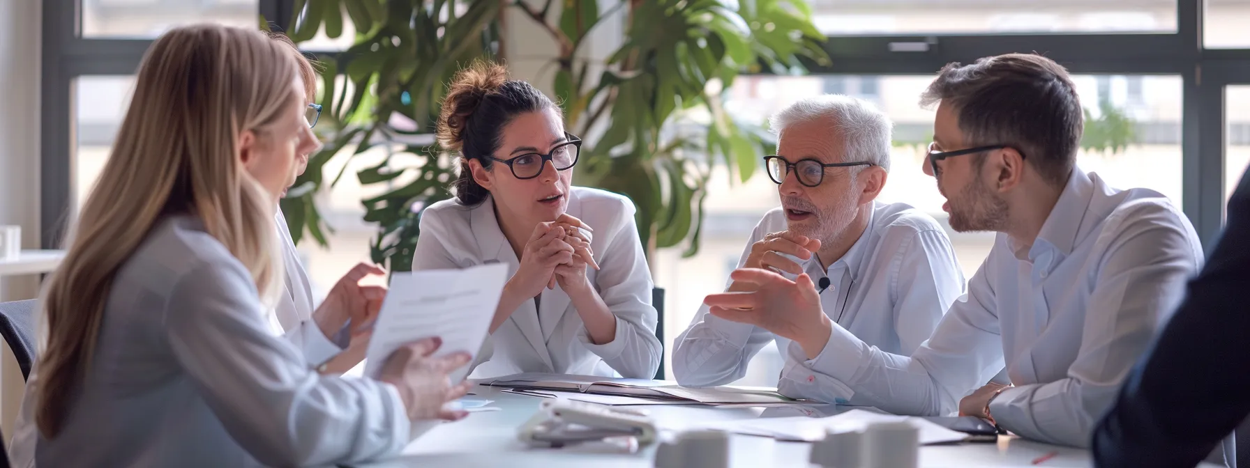 a group of business professionals gathered around a table, engaged in animated discussion about the benefits of choosing the right dermatologist in cherry hill.