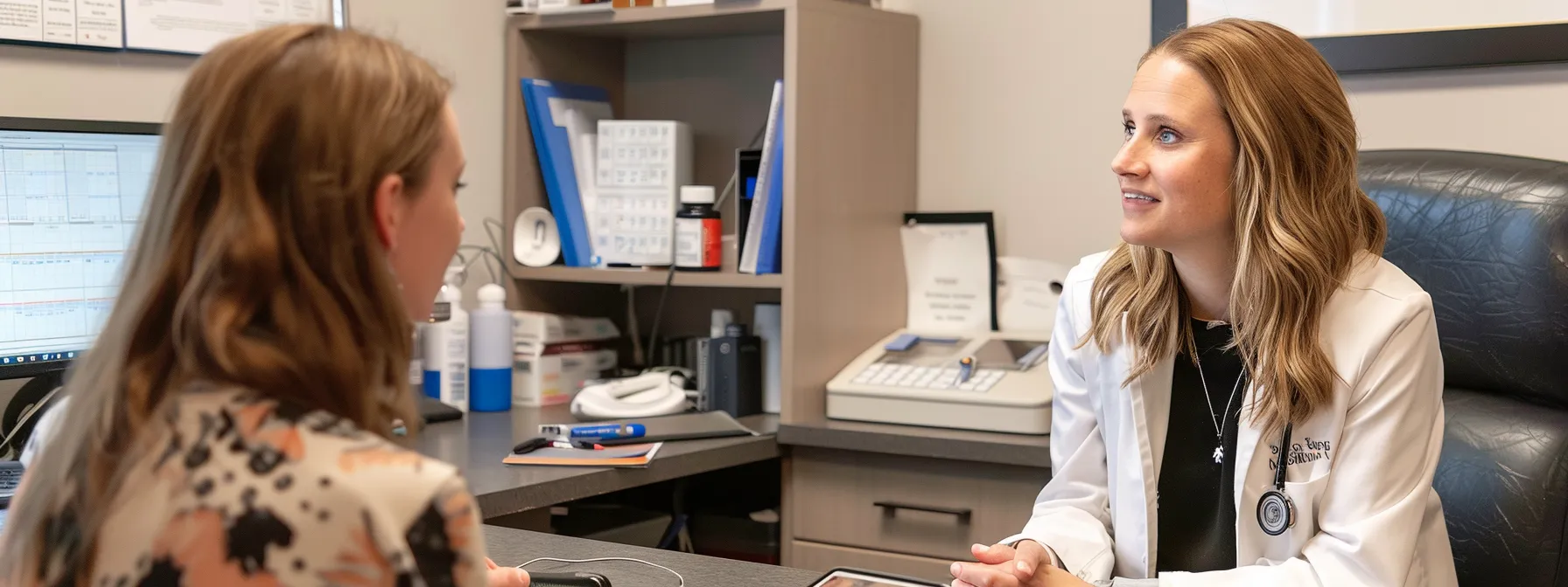 a professional agency consulting with a dermatologist in cherry hill, discussing specialized skin treatments.